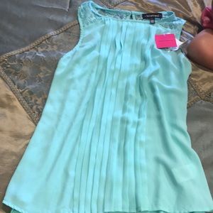 Sleeveless light green dressy top with tags...